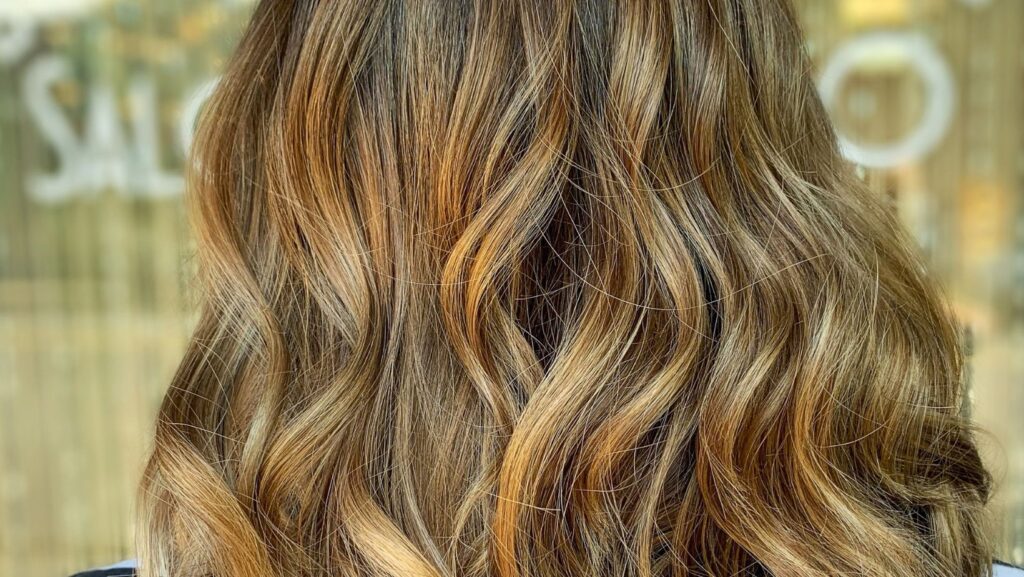 caramel balayage highlights curly hair