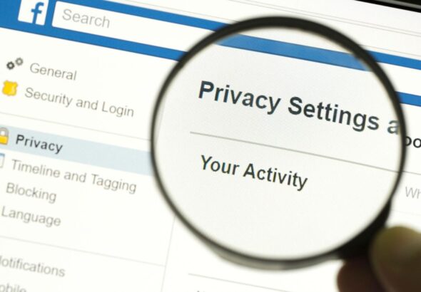 Facebook privacy settings under a magnifying glass